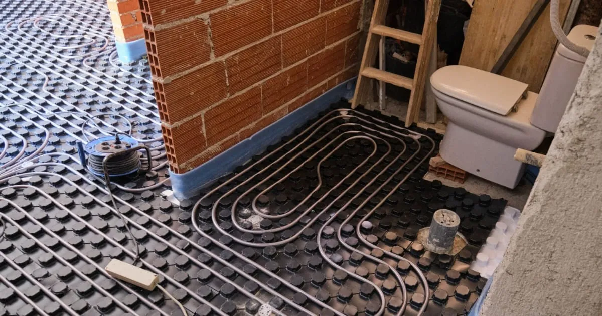 A modern bathroom with a warm, tiled floor thanks to electric underfloor heating.