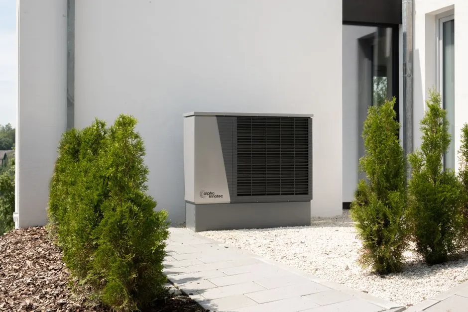 Air source heat pump outside a UK home