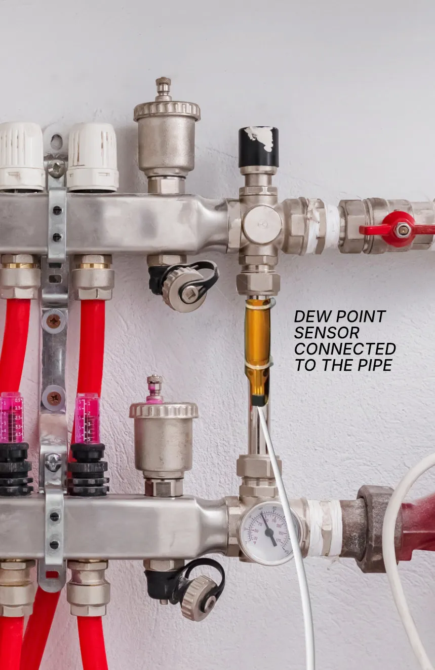 typical UK underfloor manifold with dew point sensor