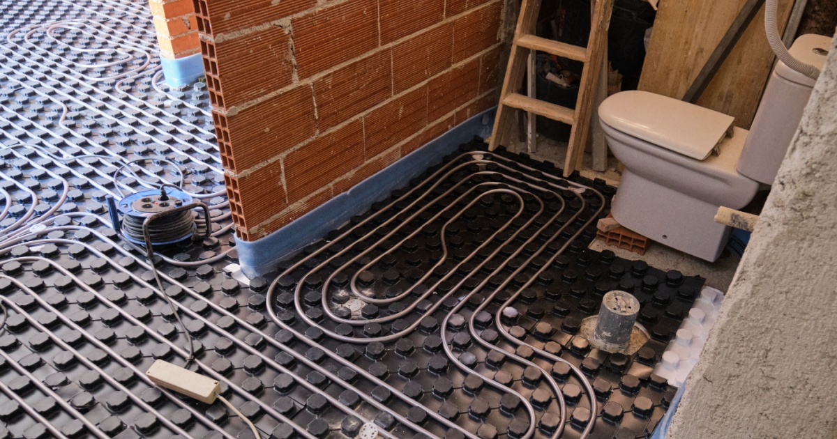 A luxurious modern bathroom with a clean aesthetic, made possible by invisible underfloor heating.